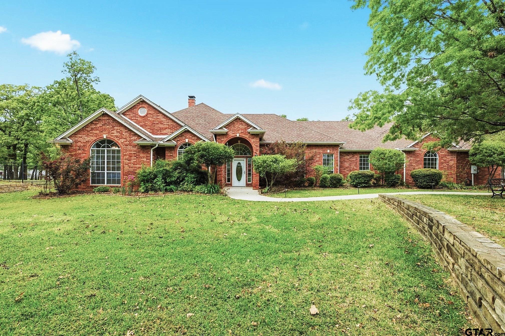 511 Rcr 3346 Emory, TX 75440 - Photo 5 of 48 a front view of a house with a yard