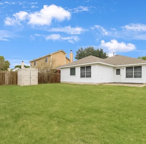 a view of a yard in front of a house