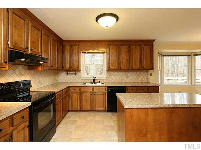 2700 Mattlyn Court Raleigh, NC 27613 - Photo 7 of 25 New range, counter tops, fixtures and lighting. Kitchen