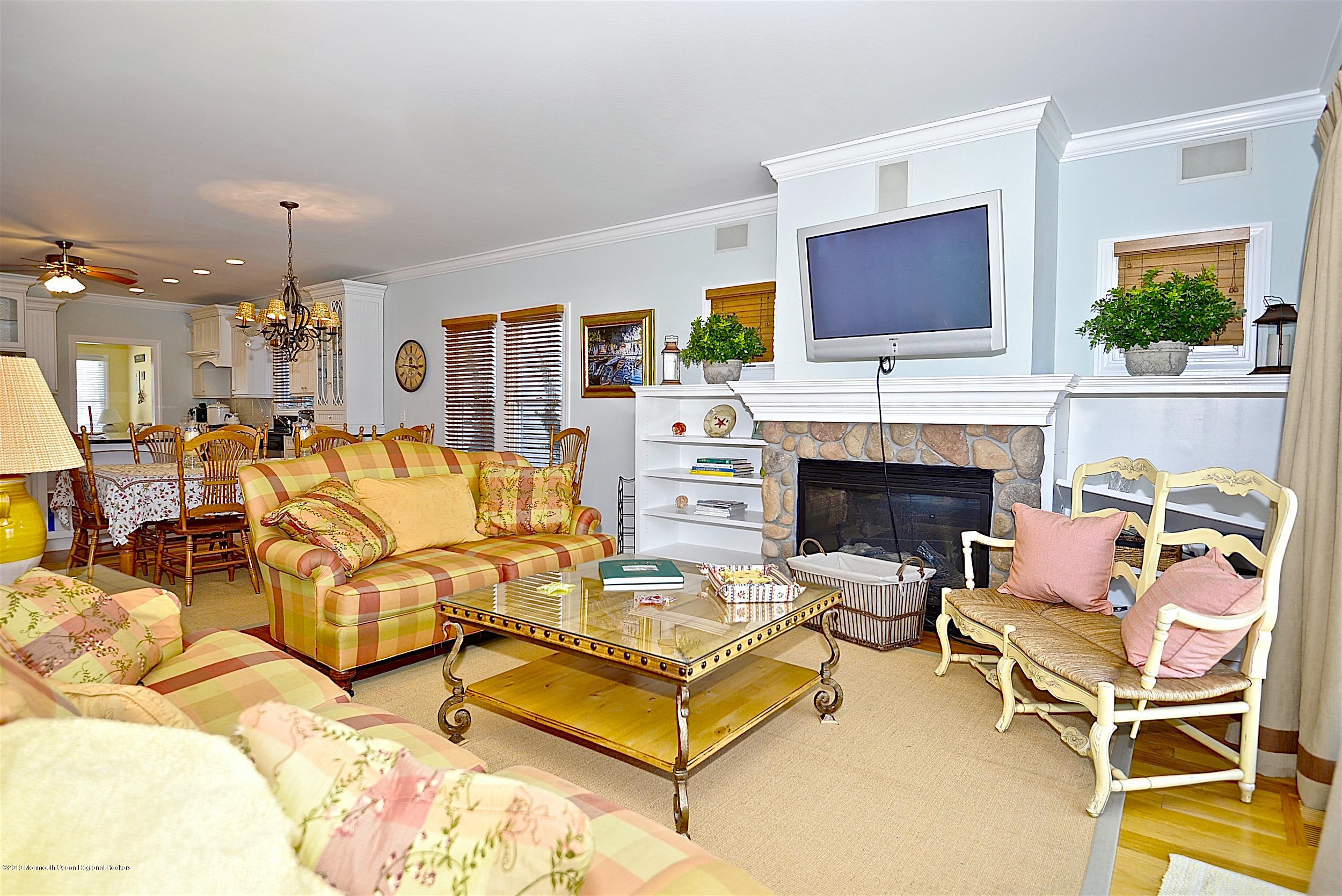 209 1st Avenue Spring Lake, NJ 07762 - Photo 17 of 19 a living room with furniture fireplace and flat screen tv