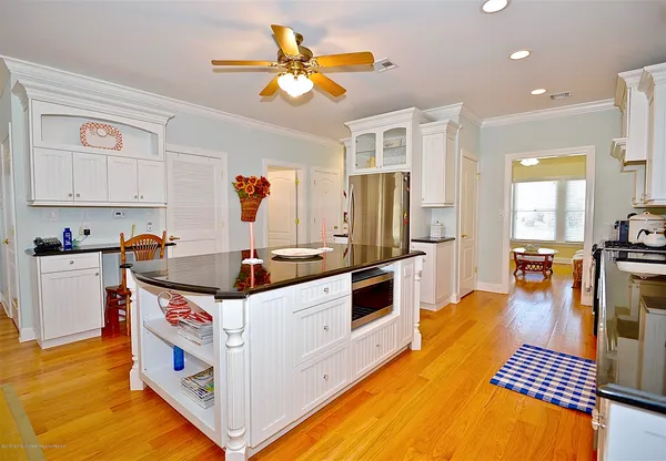 a kitchen with stainless steel appliances granite countertop a stove and a refrigerator