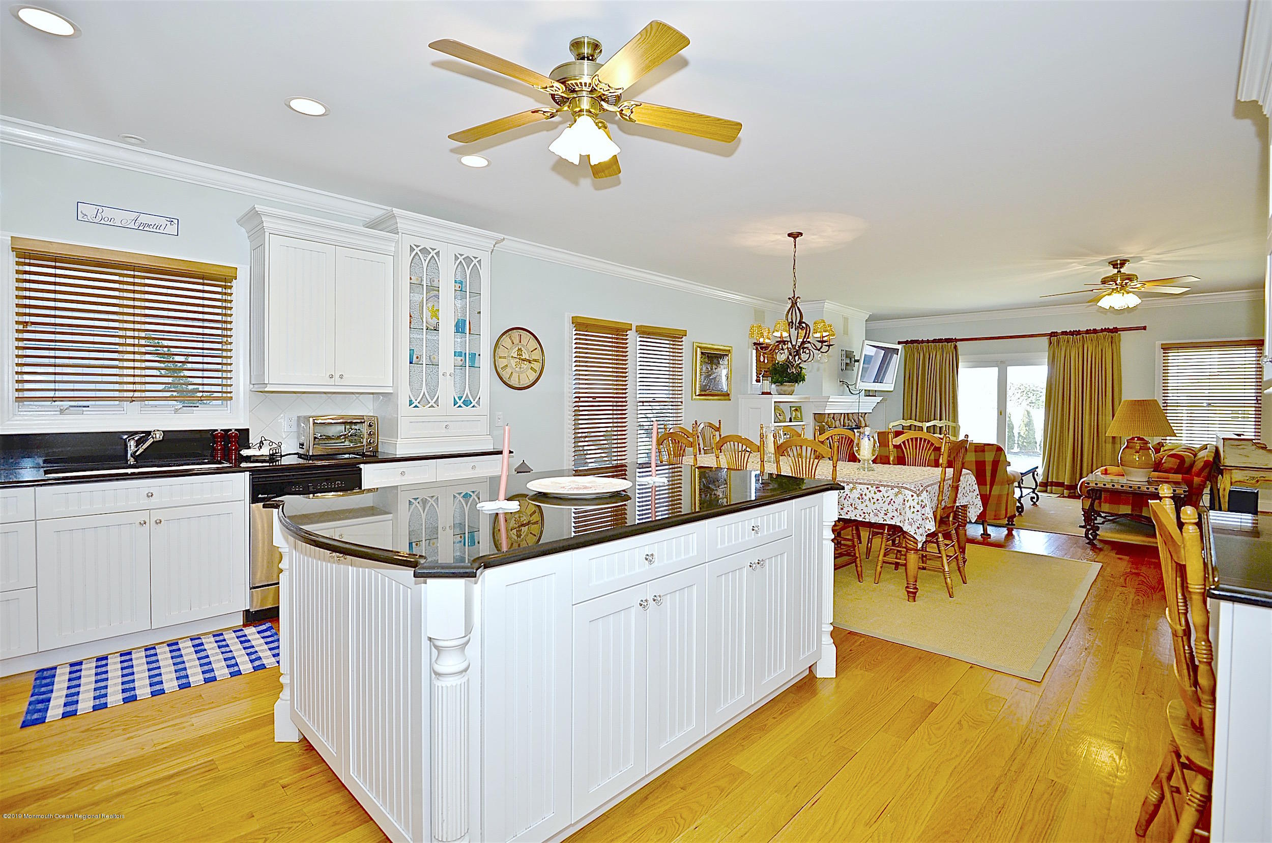 209 1st Avenue Spring Lake, NJ 07762 - Photo 6 of 19 a kitchen with a sink a counter top space and living room view
