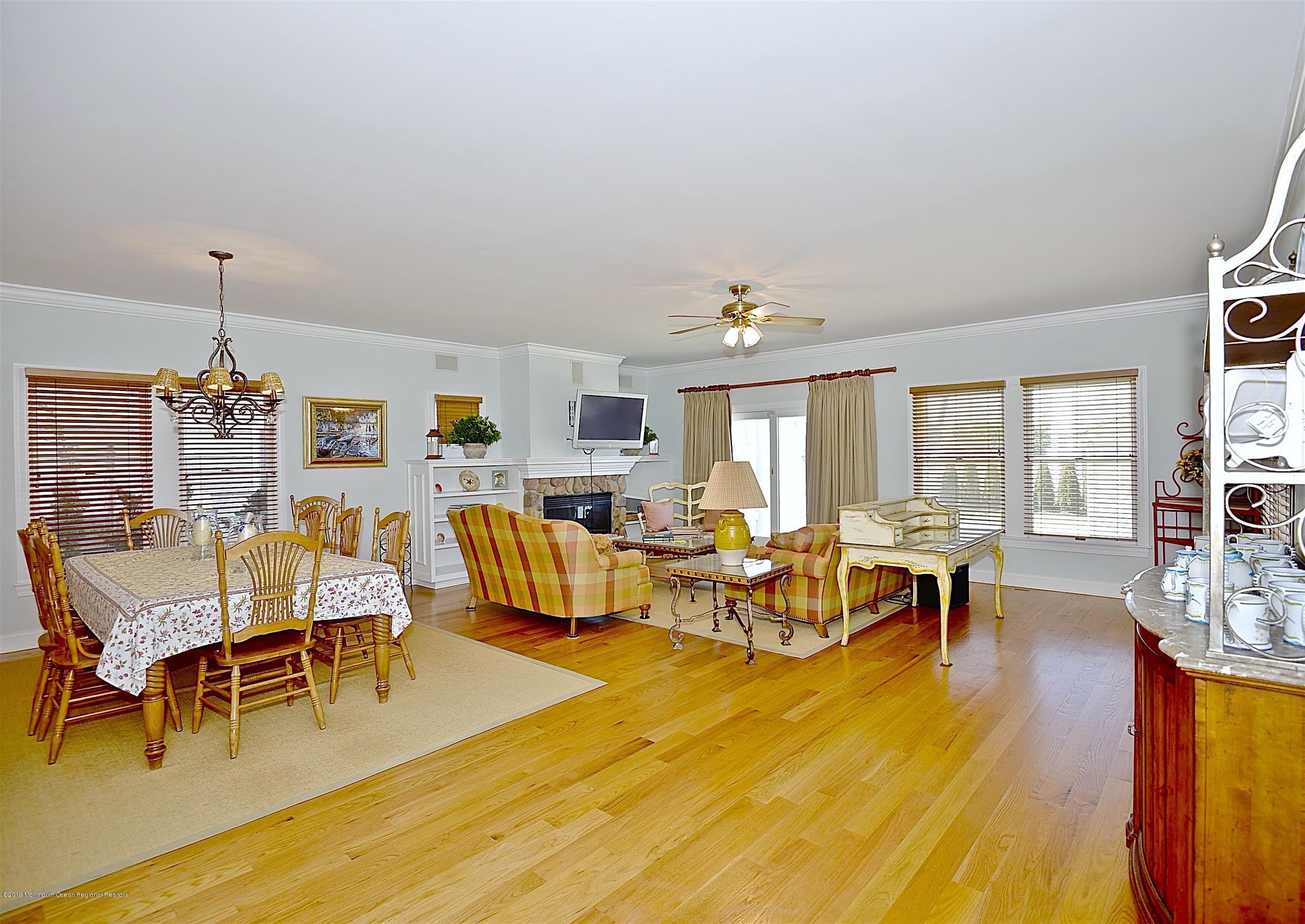 209 1st Avenue Spring Lake, NJ 07762 - Photo 8 of 19 a living room with fireplace furniture and a wooden floor