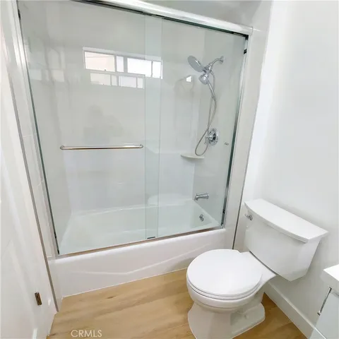 a bathroom with a shower and a toilet