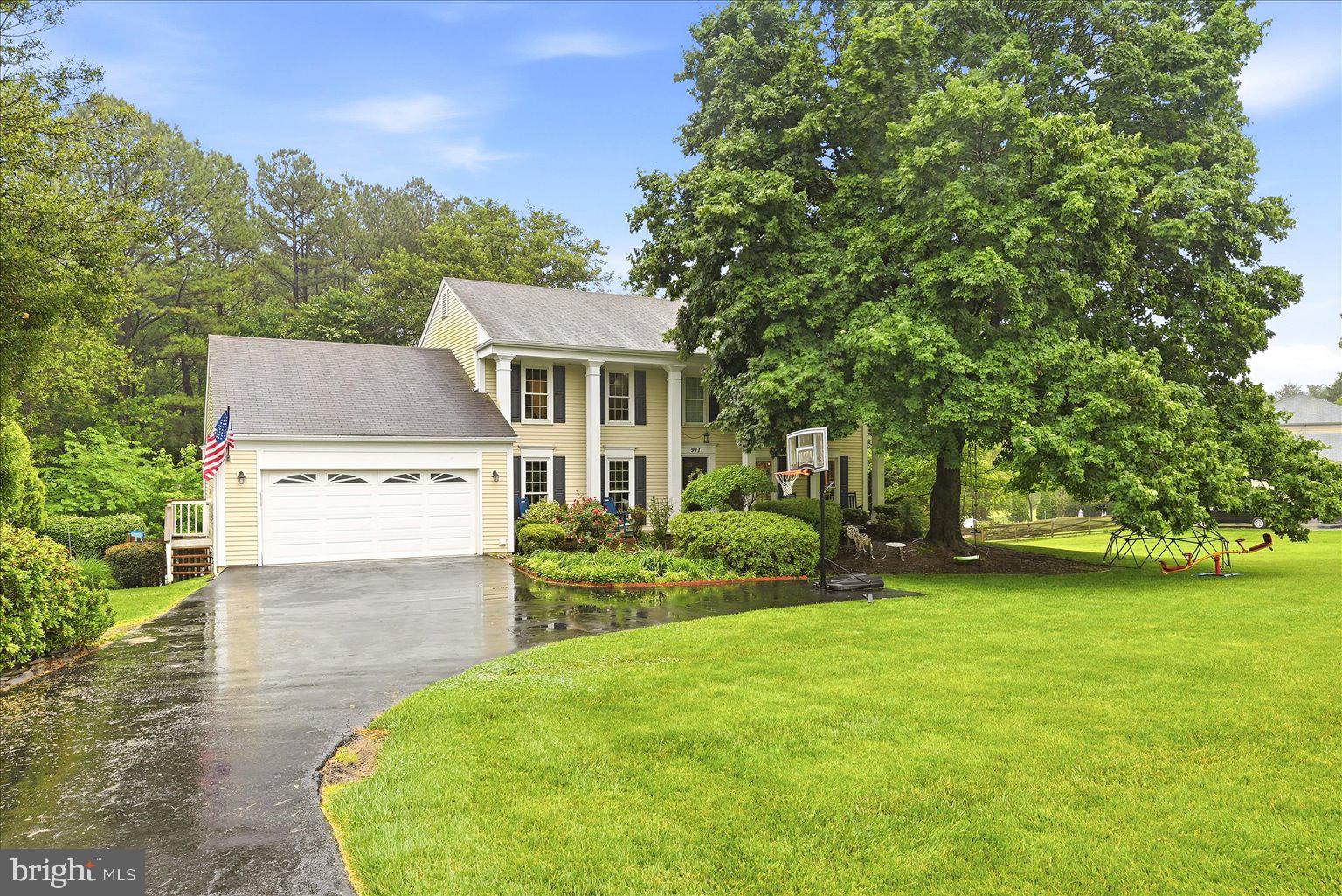 911 Riva Ridge Drive Great Falls, VA 22066 - Photo 1 of 55 Charming home with lush greenery.