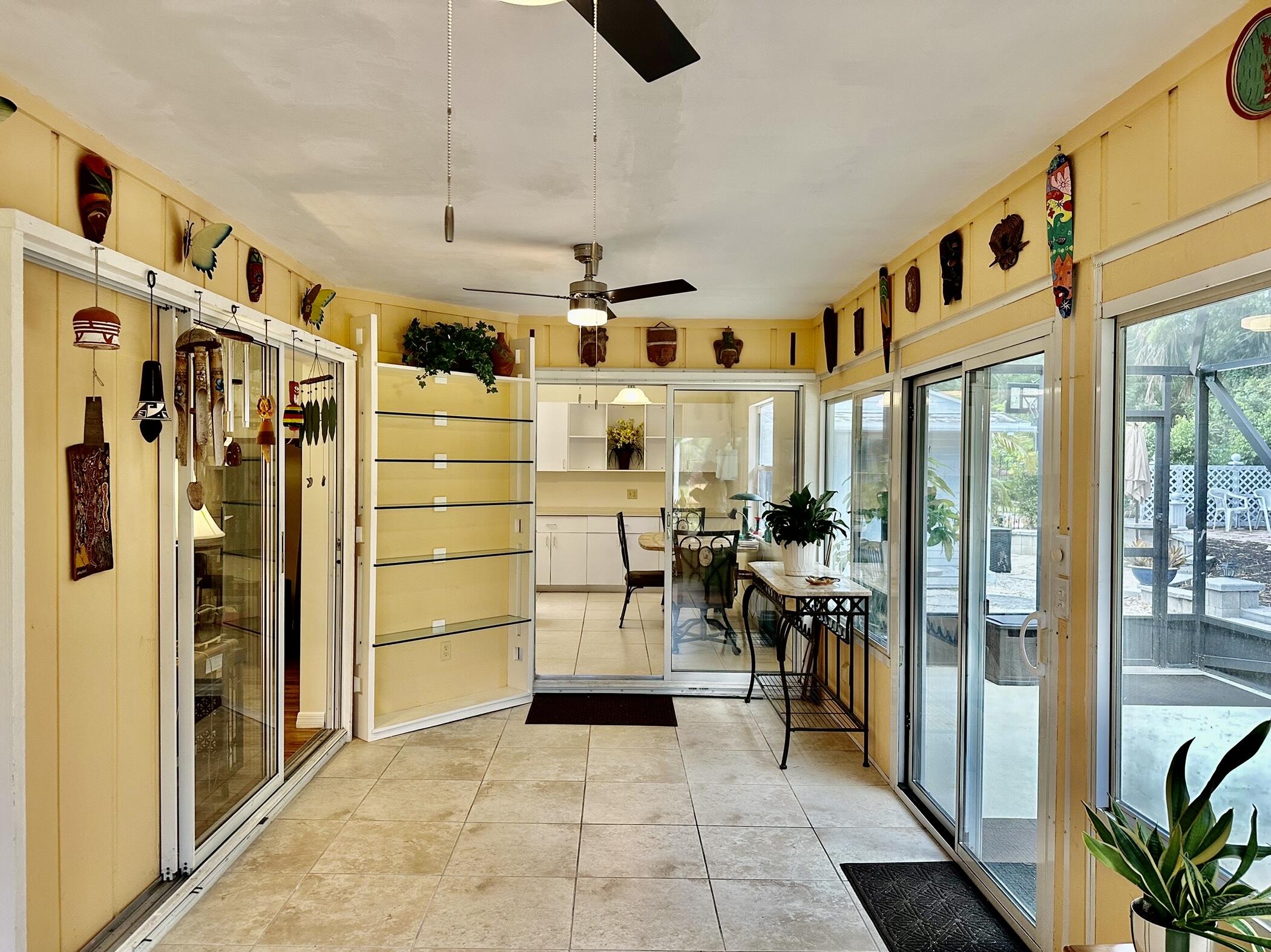 2279 Southeast Blossom Road Port St. Lucie, FL 34952 - Photo 17 of 38 Enclosed porch with glass windows