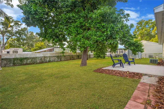 a view of yard with swimming pool