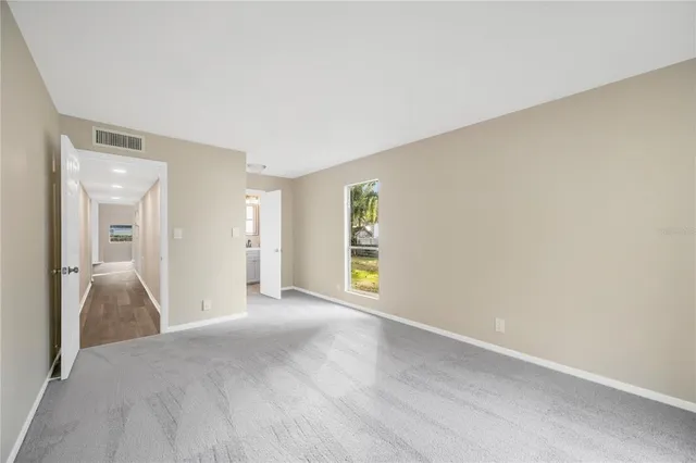 a view of an empty room and window