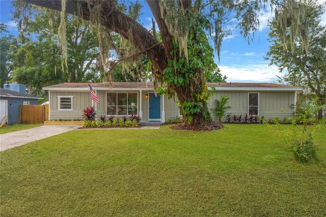 a front view of house with yard and green space