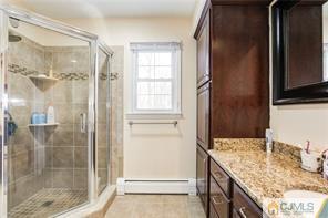 18 Devon Road Edison, NJ 08820 - Photo 17 of 25 a bathroom with a granite countertop sink and shower