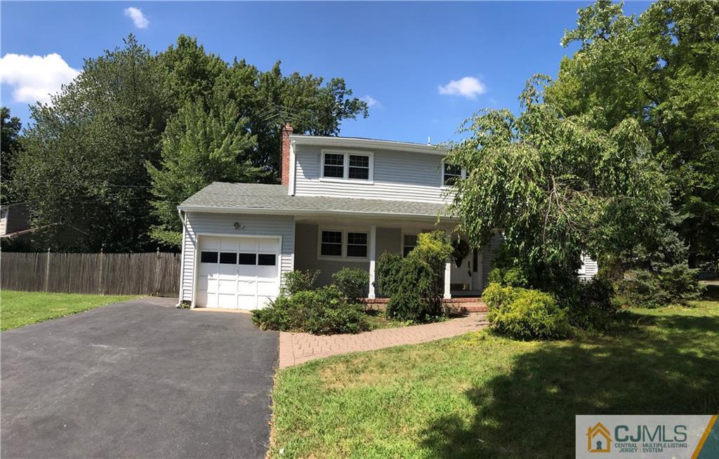 18 Devon Road Edison, NJ 08820 - Photo 23 of 25 a front view of a house with garden