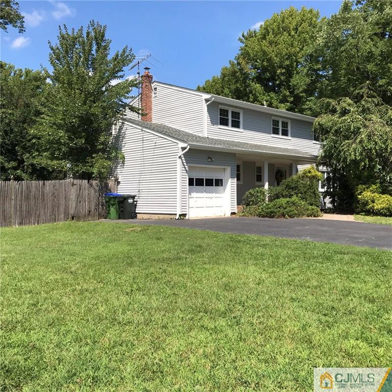 18 Devon Road Edison, NJ 08820 - Photo 24 of 25 a front view of a house with garden