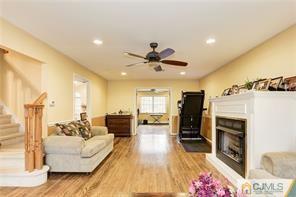 18 Devon Road Edison, NJ 08820 - Photo 8 of 25 a living room with furniture and a fireplace