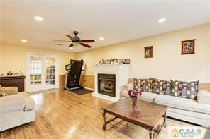 18 Devon Road Edison, NJ 08820 - Photo 9 of 25 a living room with furniture and a fireplace