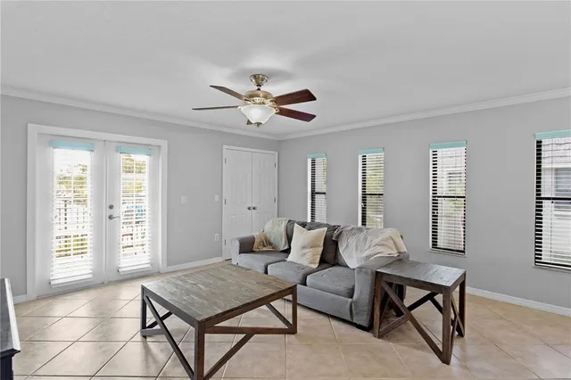 a living room with furniture a table and a window
