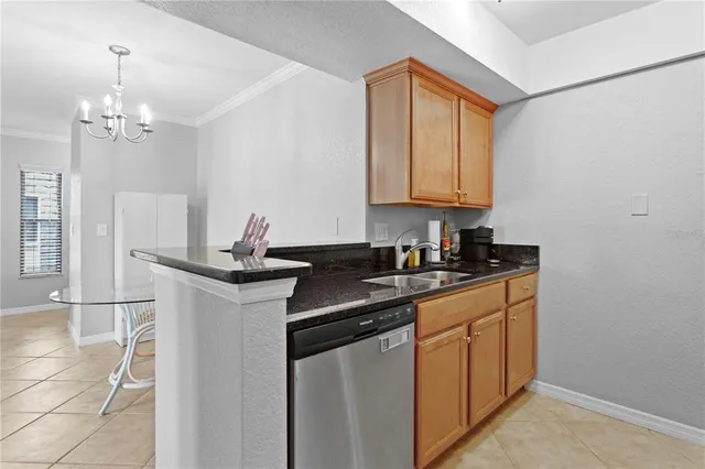 a kitchen with stainless steel appliances granite countertop a sink and cabinets