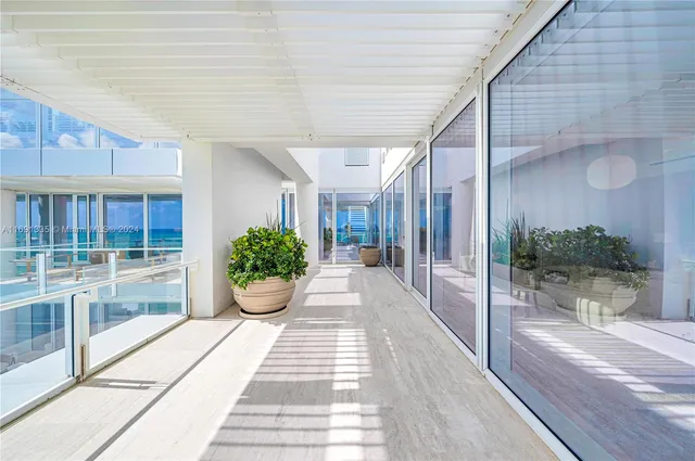 a room with furniture and a large window