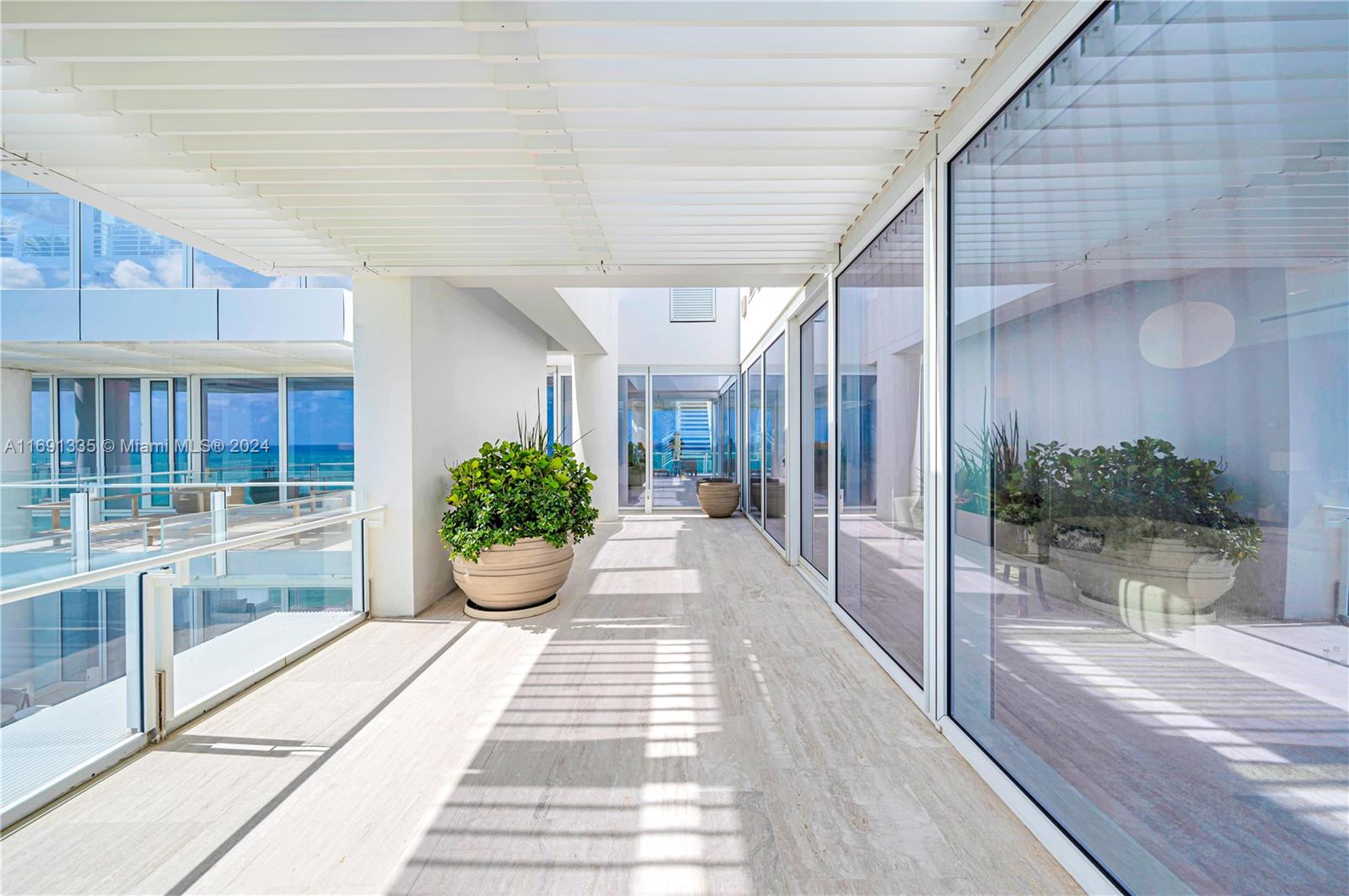 9111 Collins Avenue, Unit NPH6 Surfside, FL 33154 - Photo 19 of 66 a view of a entryway door front of house