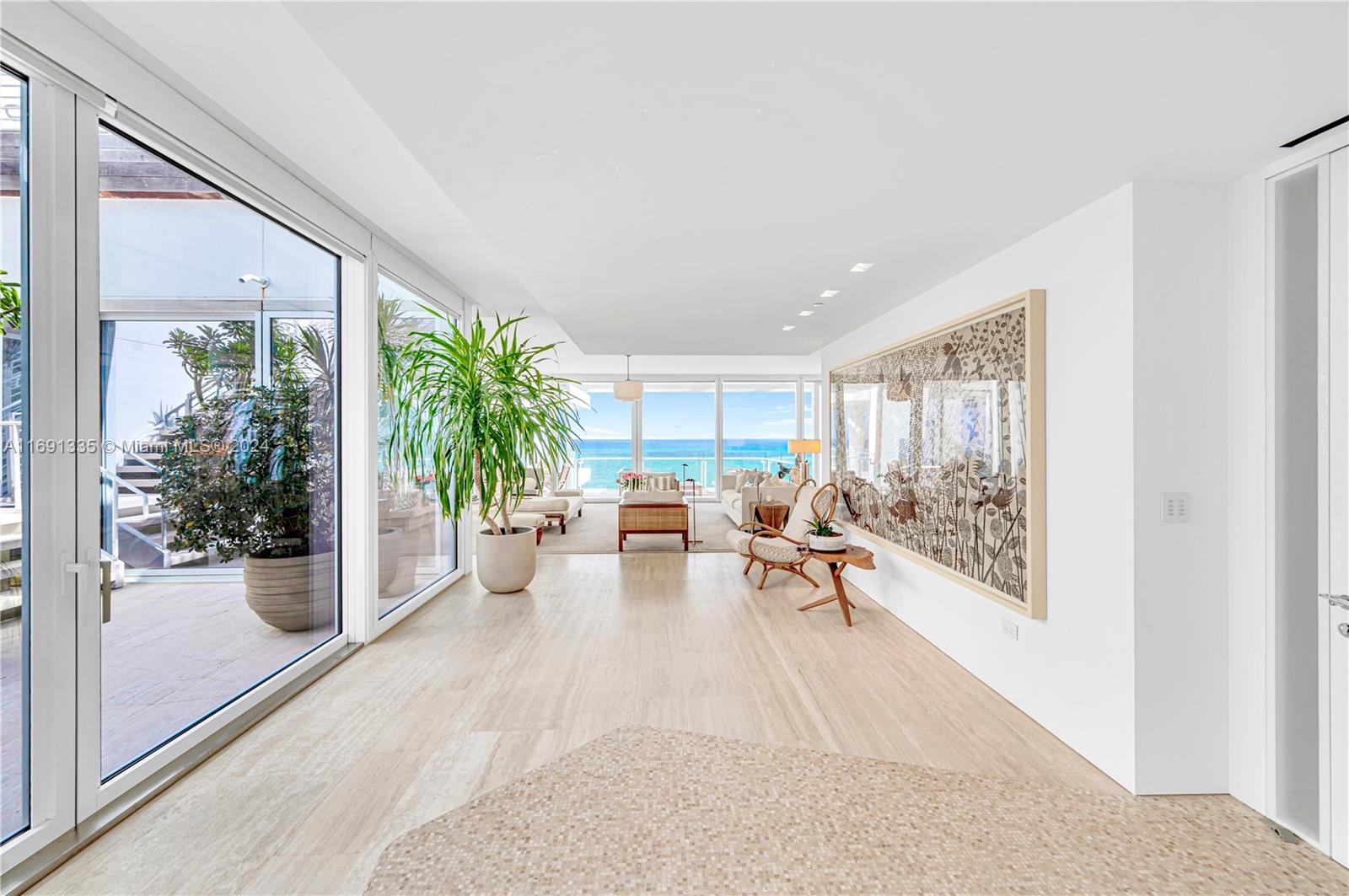 9111 Collins Avenue, Unit NPH6 Surfside, FL 33154 - Photo 3 of 66 a living room with furniture and a potted plant