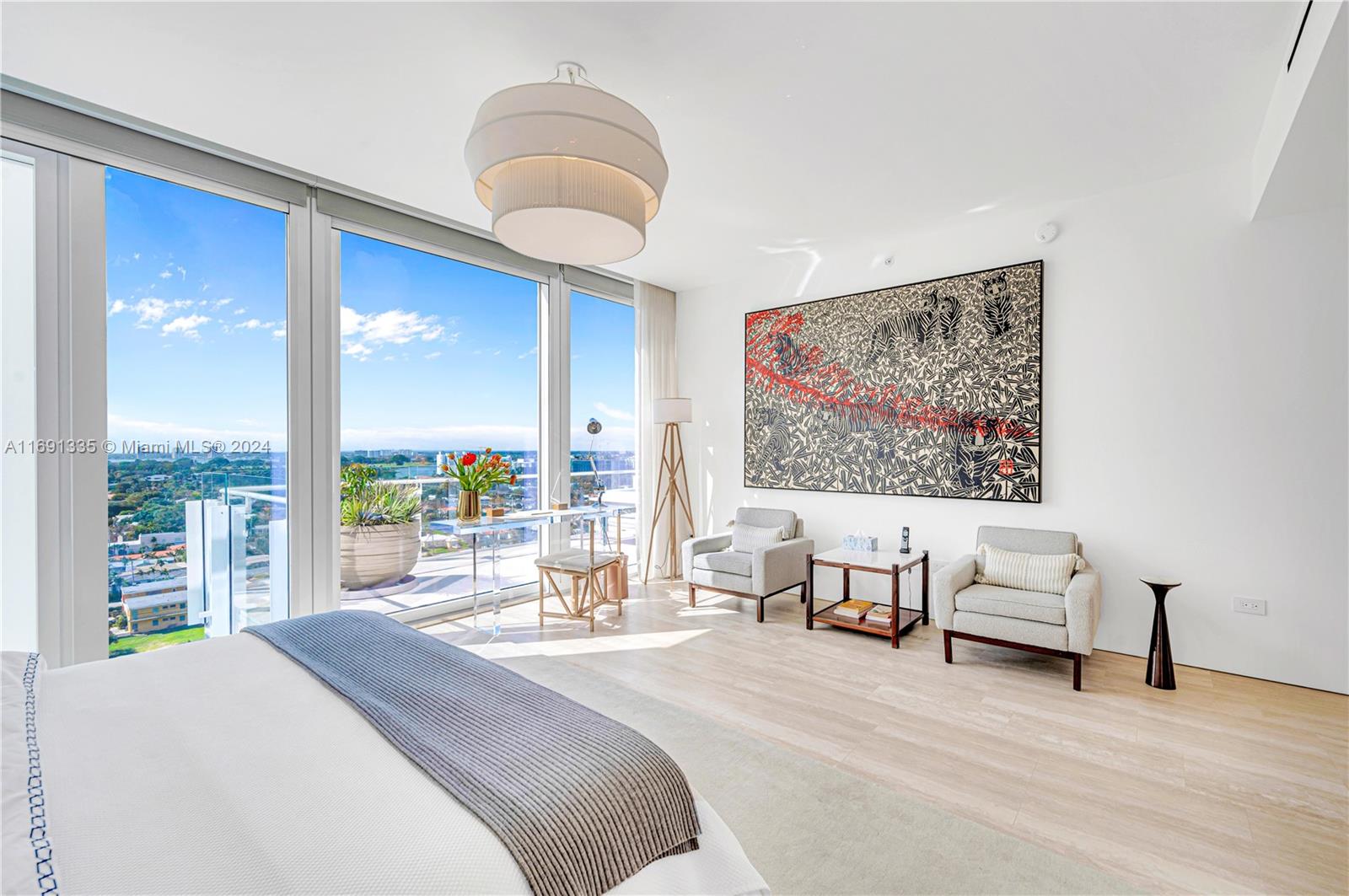 9111 Collins Avenue, Unit NPH6 Surfside, FL 33154 - Photo 38 of 66 a bedroom with a large bed and a large window