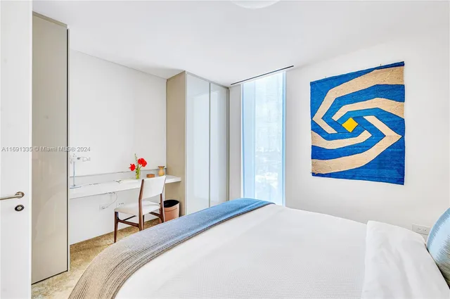 a view of a patio with table and chairs with wooden floor and fence