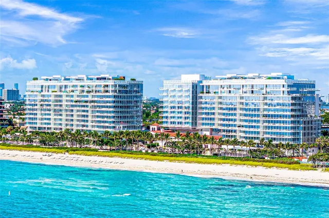 a view of a house with a swimming pool and a yard