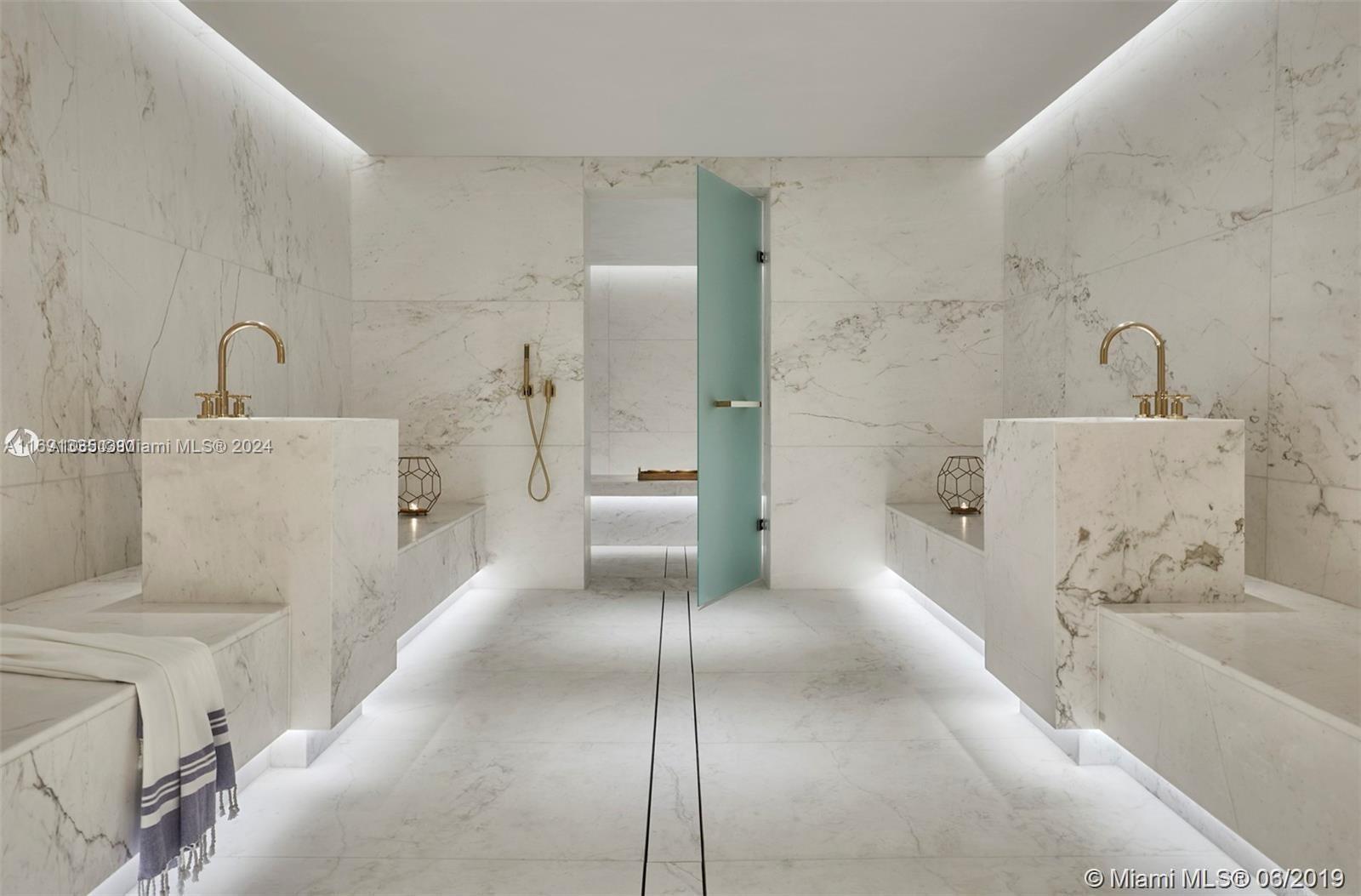 9111 Collins Avenue, Unit NPH6 Surfside, FL 33154 - Photo 65 of 66 a bathroom with a tub sink and mirror