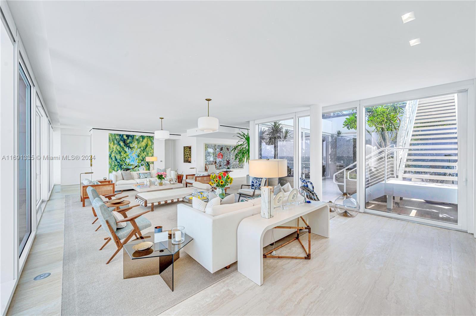 9111 Collins Avenue, Unit NPH6 Surfside, FL 33154 - Photo 7 of 66 a living room with furniture and a table with wooden floor