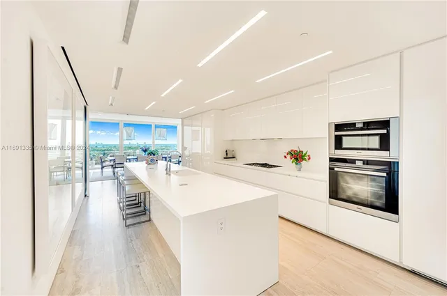 a view of kitchen with cabinets and stainless steel appliances