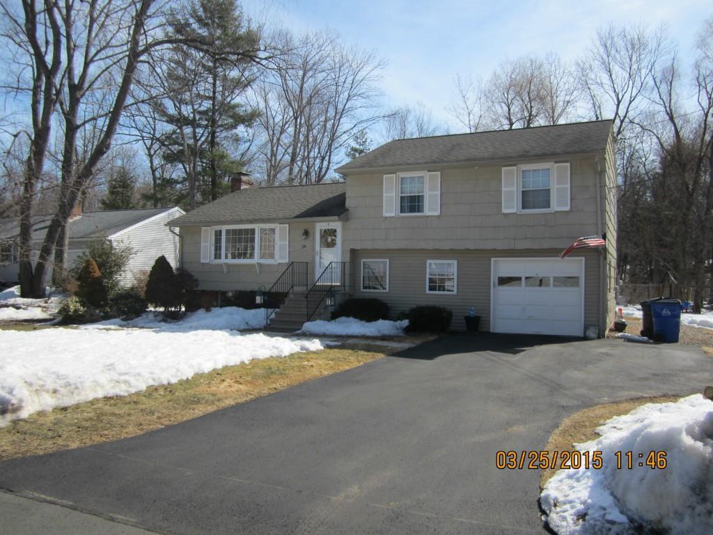 a view of a house with a snow in the yard
