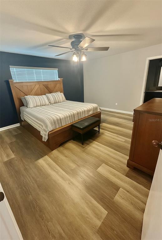 6812 Arbor Oaks Drive Bradenton, FL 34209 - Photo 18 of 29 a bedroom with a bed and walk in closet