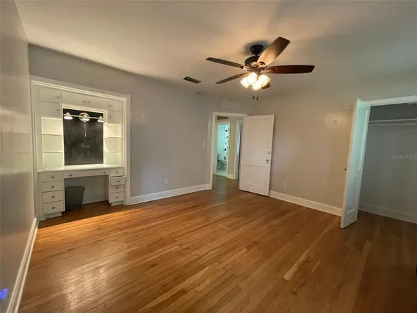a view of a livingroom with an empty space and a window