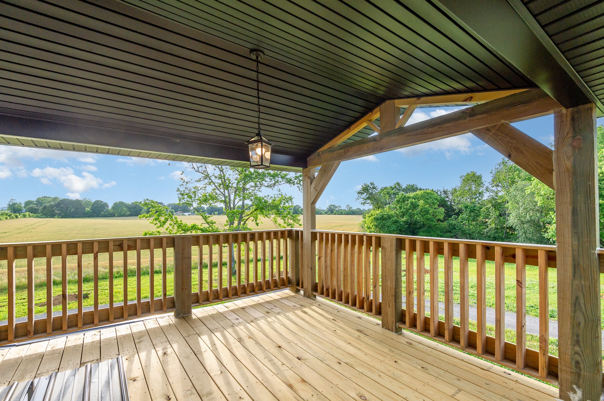 5837 Rocky Mound Road Westmoreland, TN 37186 - Photo 13 of 41 a view of wooden balcony with a yard
