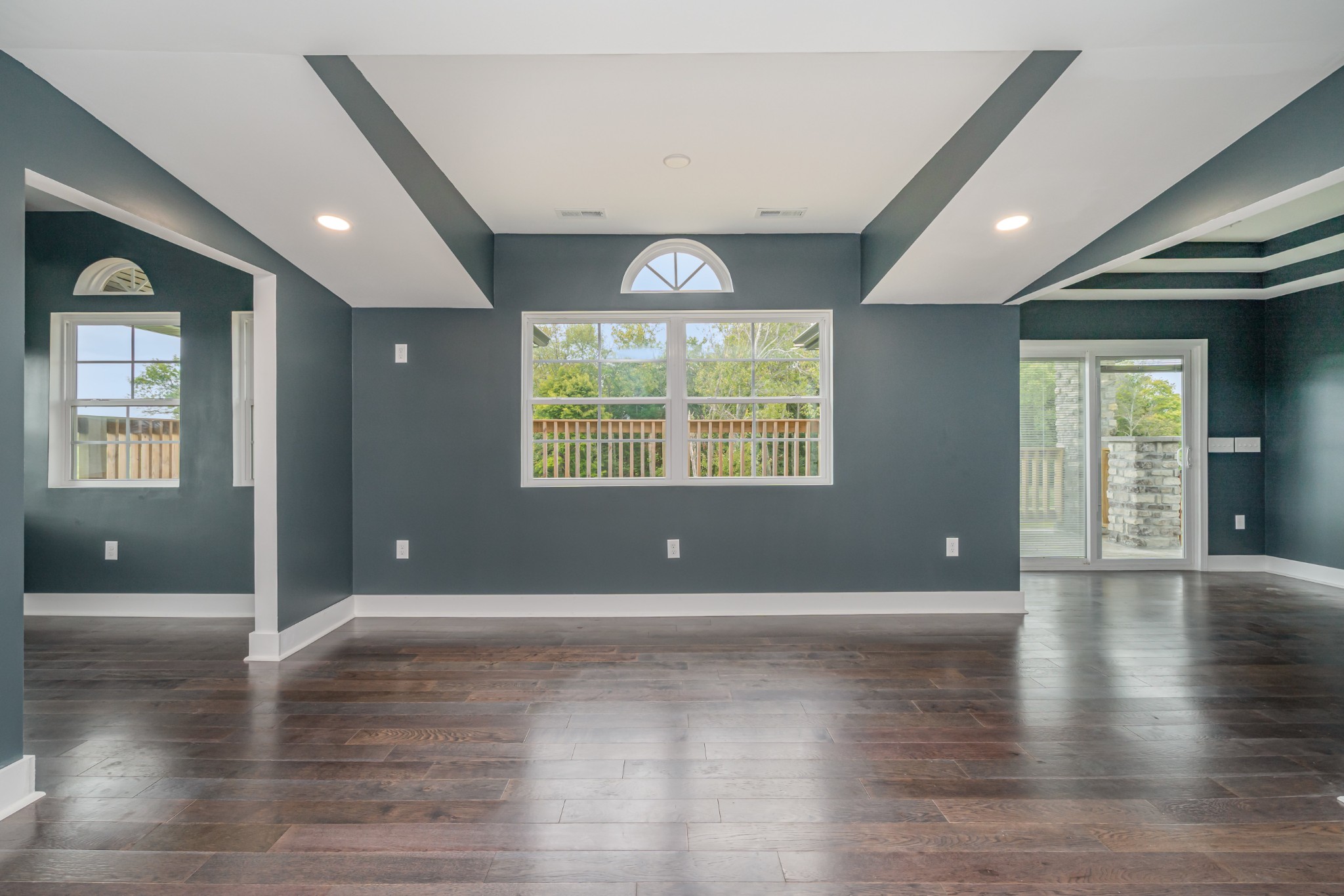 5837 Rocky Mound Road Westmoreland, TN 37186 - Photo 15 of 41 an empty room with wooden floor and windows