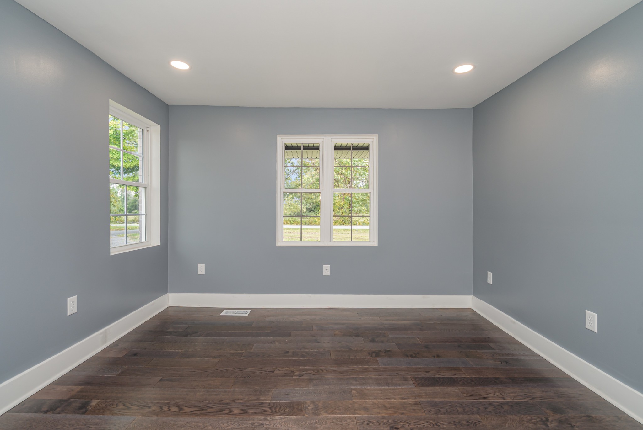5837 Rocky Mound Road Westmoreland, TN 37186 - Photo 25 of 41 an empty room with wooden floor and windows