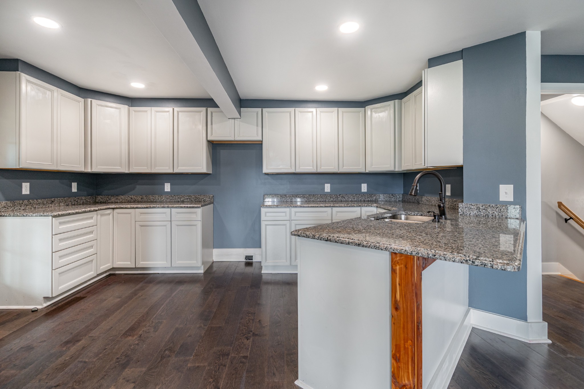 5837 Rocky Mound Road Westmoreland, TN 37186 - Photo 27 of 41 a kitchen with granite countertop white cabinets and white appliances