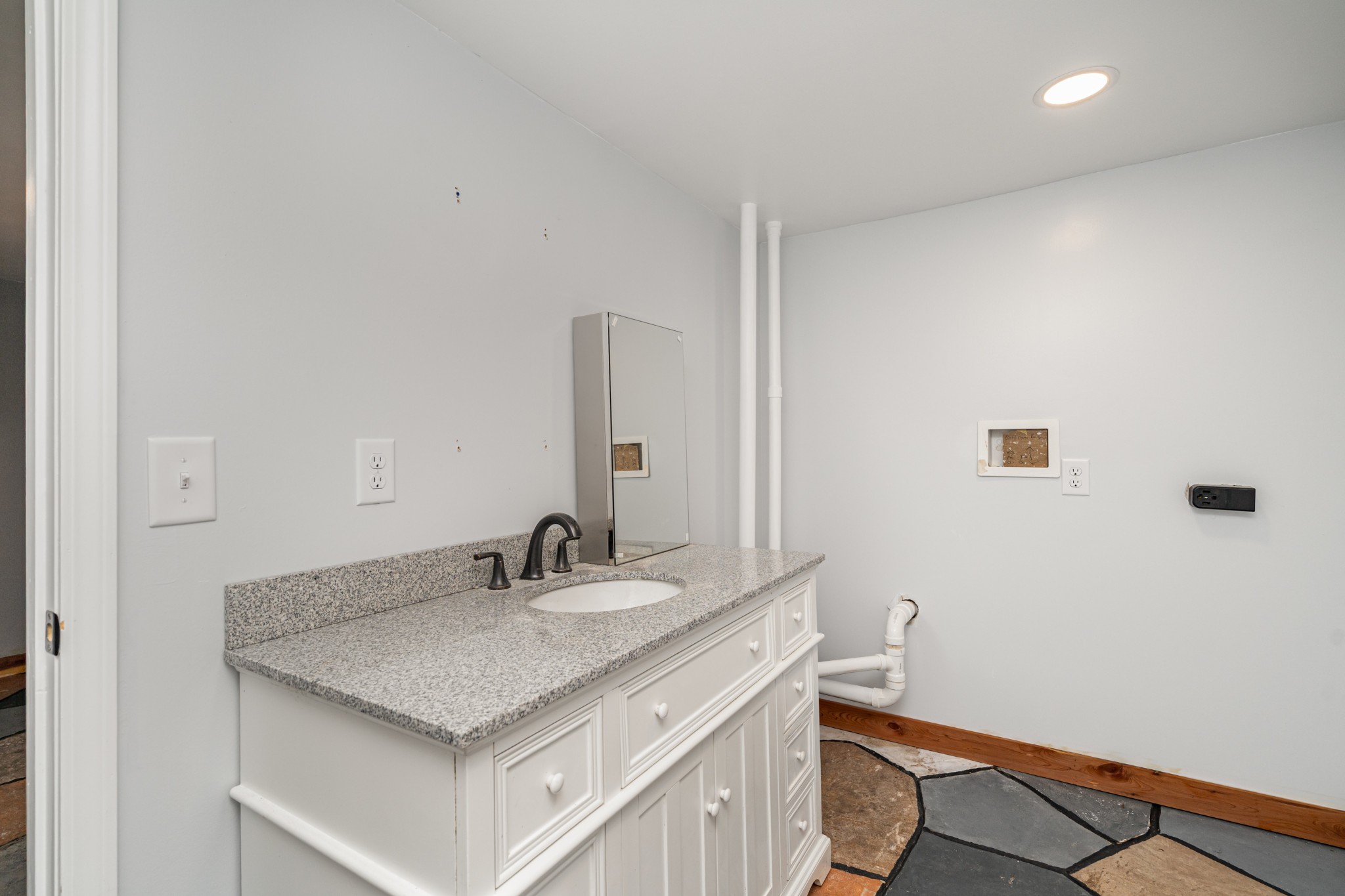 5837 Rocky Mound Road Westmoreland, TN 37186 - Photo 31 of 41 a bathroom with a granite countertop sink and a mirror