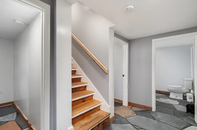 a view of a house with pool and a yard