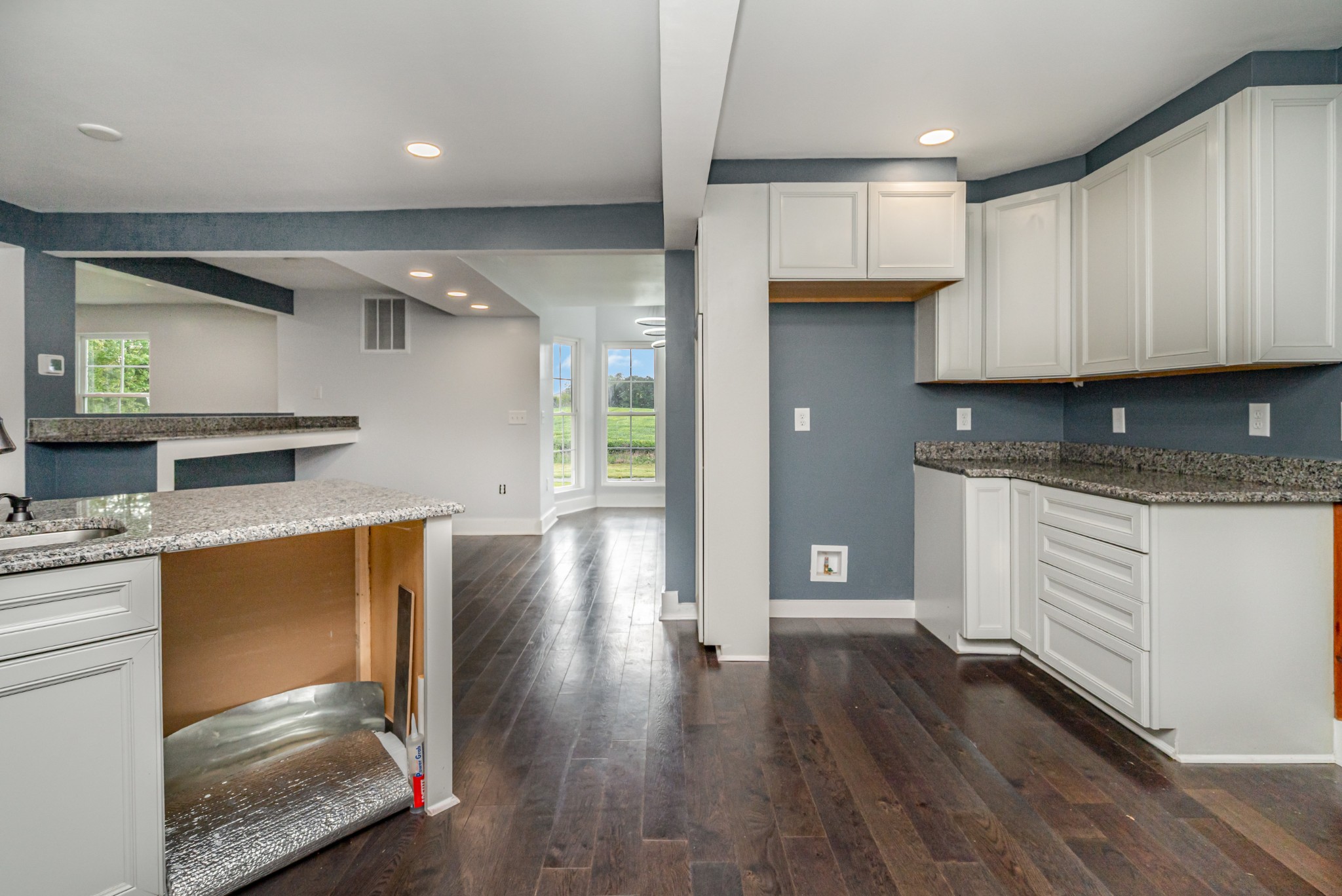 5837 Rocky Mound Road Westmoreland, TN 37186 - Photo 7 of 41 a kitchen with stainless steel appliances granite countertop a stove a sink and a refrigerator