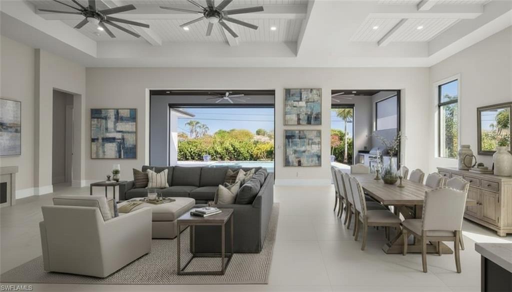 1045 Morningside Drive Naples, FL 34103 - Photo 18 of 50 Virtually Staged Living area with beam ceiling, coffered ceiling, recessed lighting, and light tile patterned floors