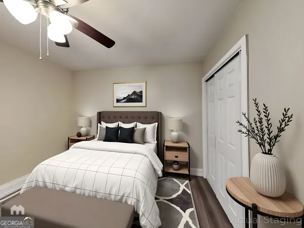 a bedroom with bed and a potted plant