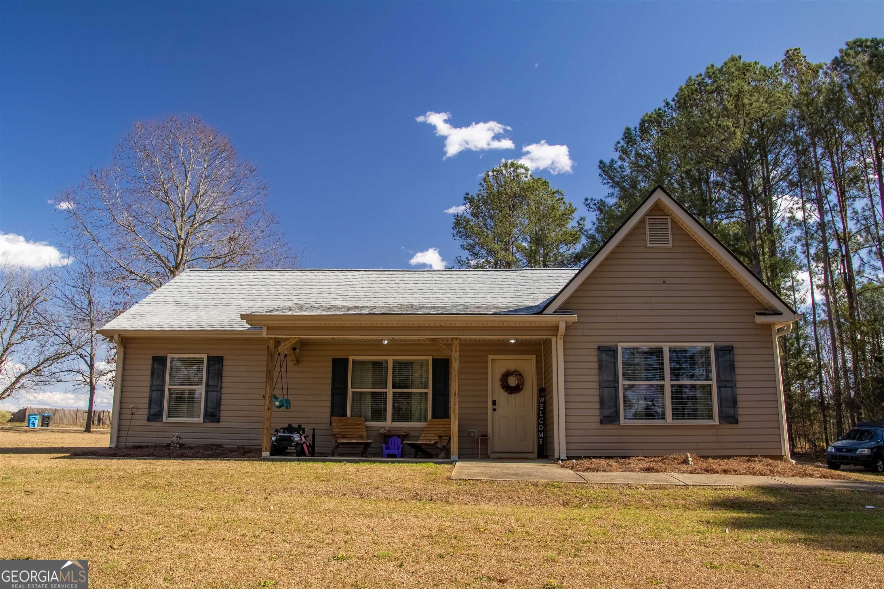 a front view of a house with a yard