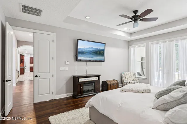 a bathroom with a granite countertop sink and a large mirror