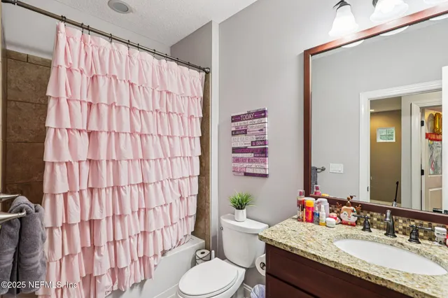 a view of a backyard with swimming pool