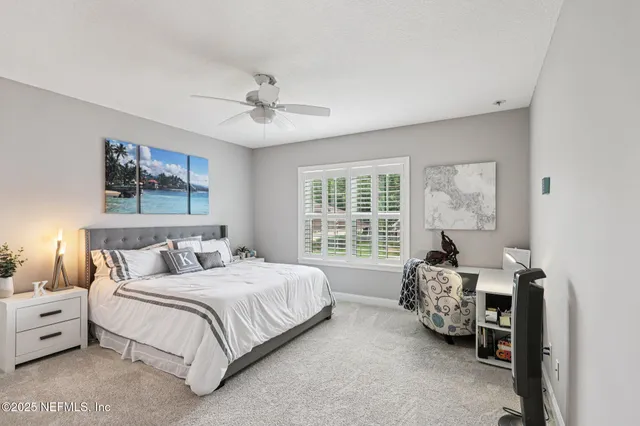an aerial view of residential house with outdoor space and trees all around