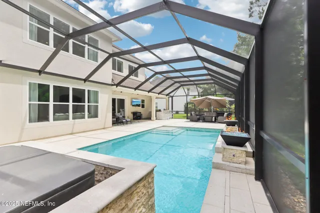 a view of a field with an trees in the background