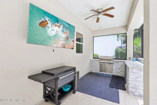 a front view of a residential houses with yard and green space