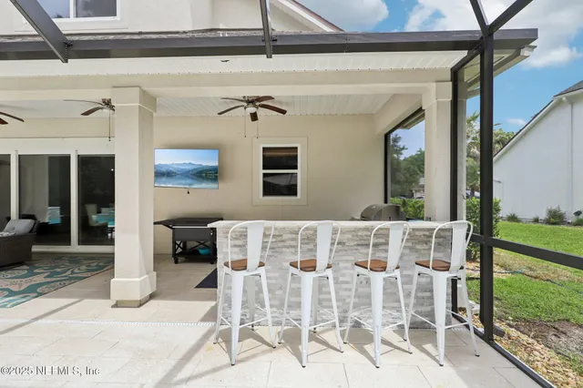 a view of a swimming pool with sitting area