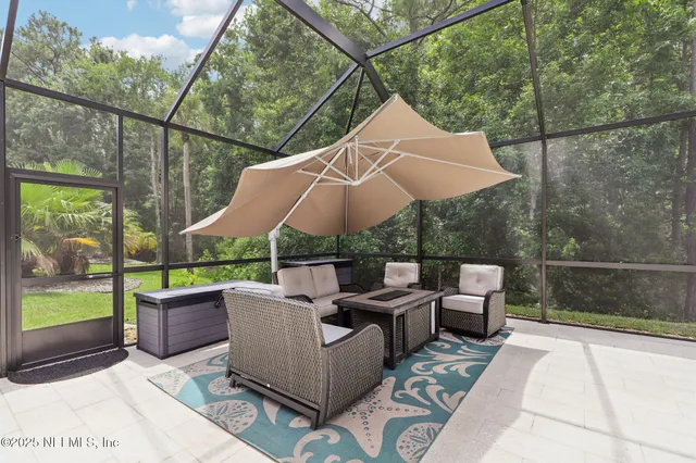 a view of backyard with wooden fence