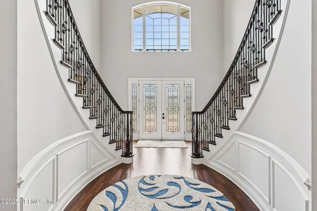 a living room with furniture fireplace and a large window
